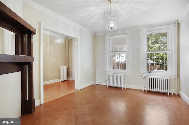 unfurnished room with radiator heating unit, parquet flooring, and crown molding