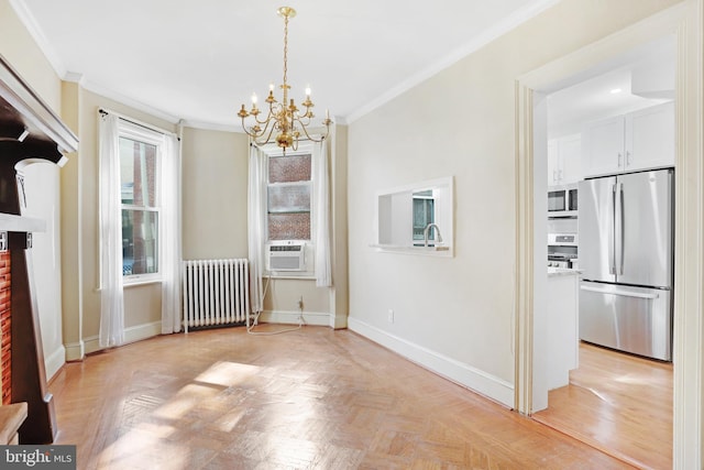 unfurnished dining area with light parquet floors, cooling unit, radiator, an inviting chandelier, and ornamental molding