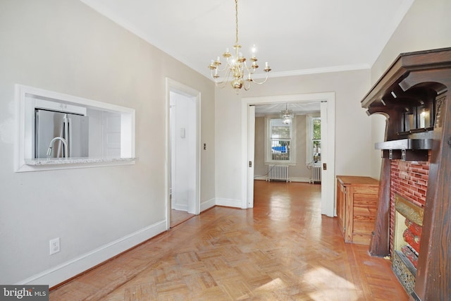 dining space featuring ornamental molding, a chandelier, radiator heating unit, and light parquet floors