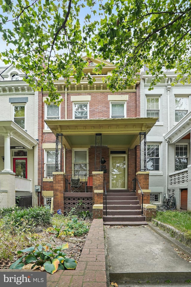 view of property with a porch