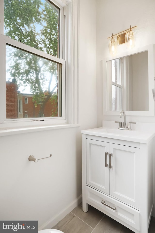 bathroom featuring vanity, plenty of natural light, and tile patterned floors