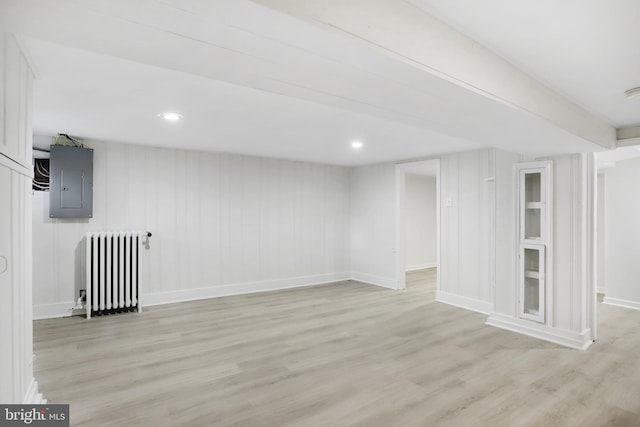 interior space featuring light hardwood / wood-style flooring, radiator, and electric panel