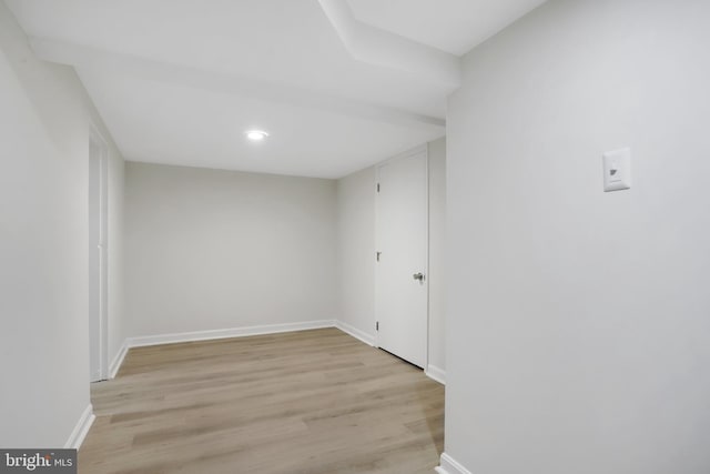 empty room with light hardwood / wood-style flooring