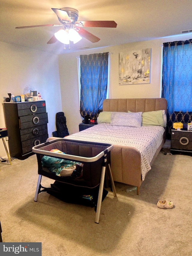 carpeted bedroom with ceiling fan