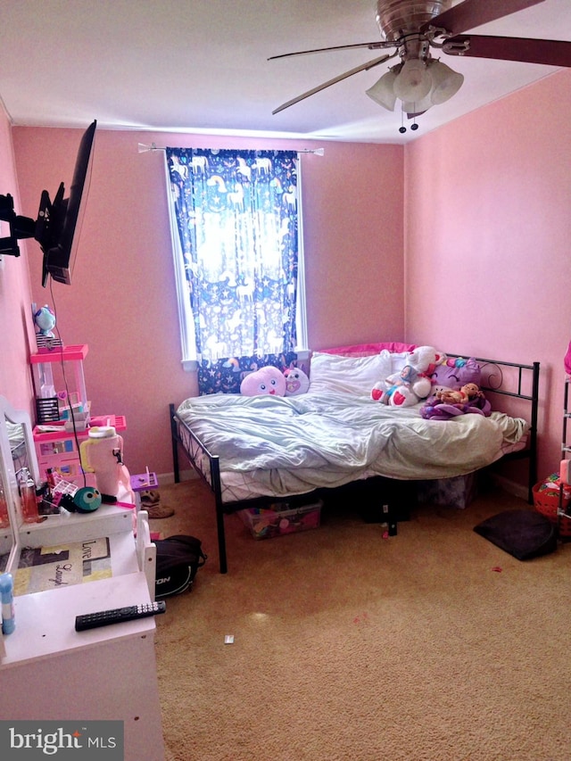 bedroom with ceiling fan and carpet