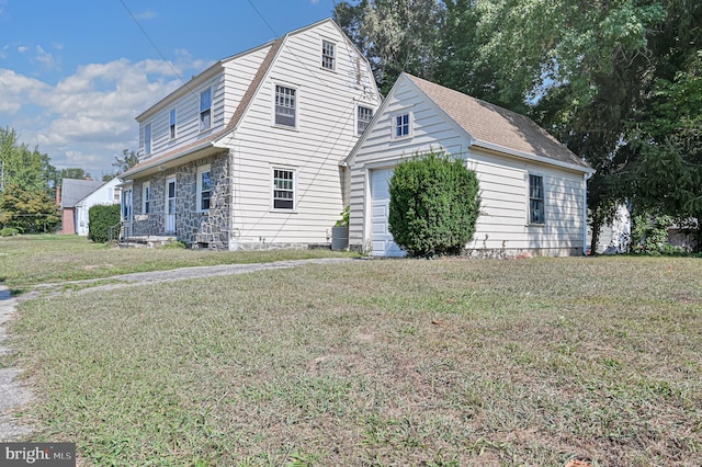 view of side of home with a lawn