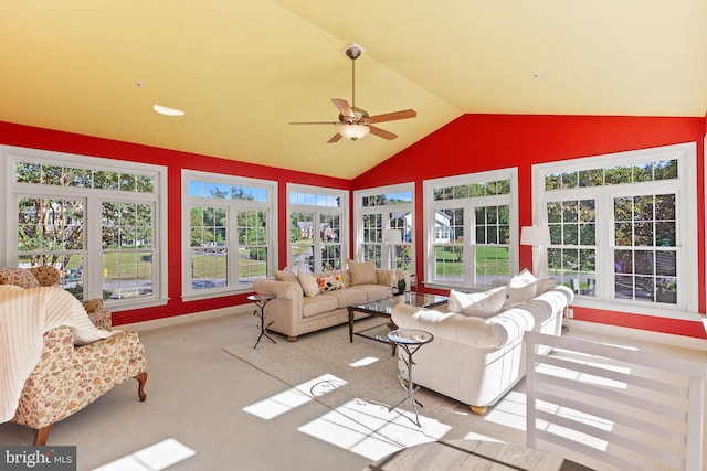 sunroom with lofted ceiling and ceiling fan