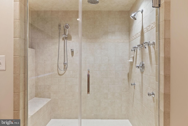 bathroom featuring an enclosed shower