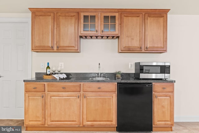 kitchen with light colored carpet, black dishwasher, dark stone counters, and sink