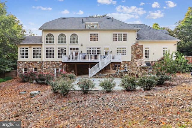 rear view of property with a patio and a deck