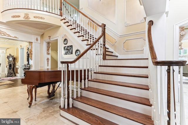 staircase with a high ceiling