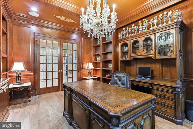 office space featuring light wood-type flooring, ornamental molding, a chandelier, and french doors