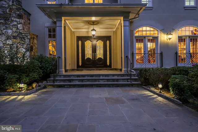 entrance to property featuring french doors