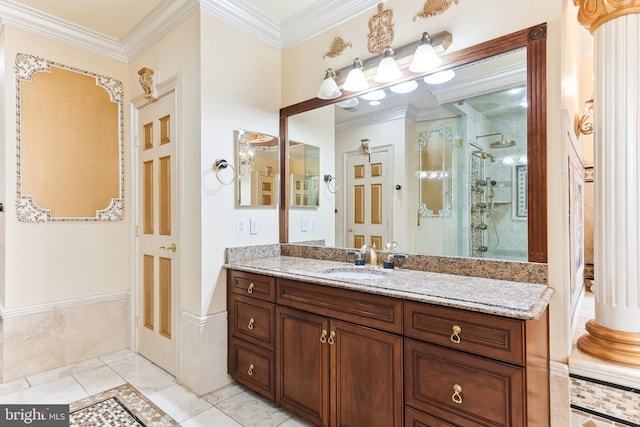 bathroom featuring vanity, a shower with shower door, ornamental molding, and tile patterned floors