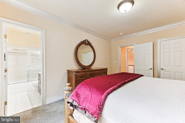 carpeted bedroom with crown molding and ensuite bathroom