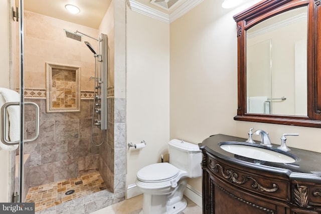 bathroom with crown molding, vanity, toilet, and a shower with shower door