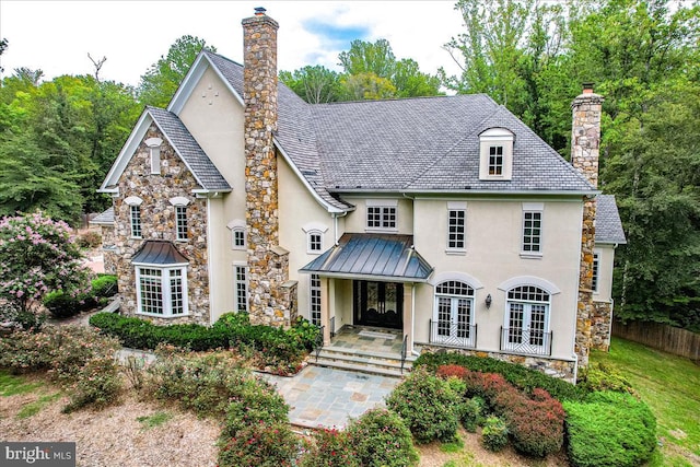 back of house featuring french doors