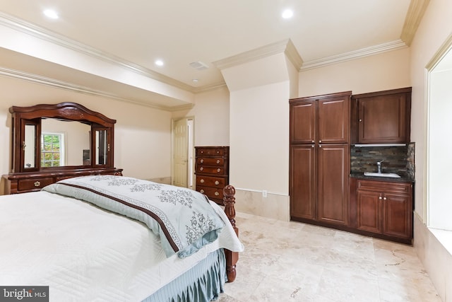 bedroom with ornamental molding and sink