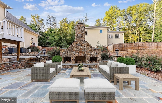 view of patio / terrace featuring an outdoor living space with a fireplace