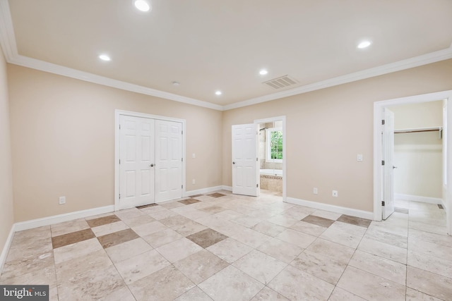 unfurnished bedroom with connected bathroom and ornamental molding