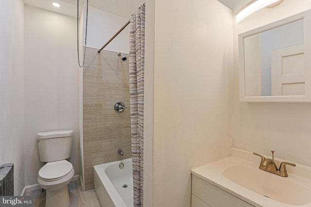 full bathroom with shower / bath combination with curtain, vanity, and toilet