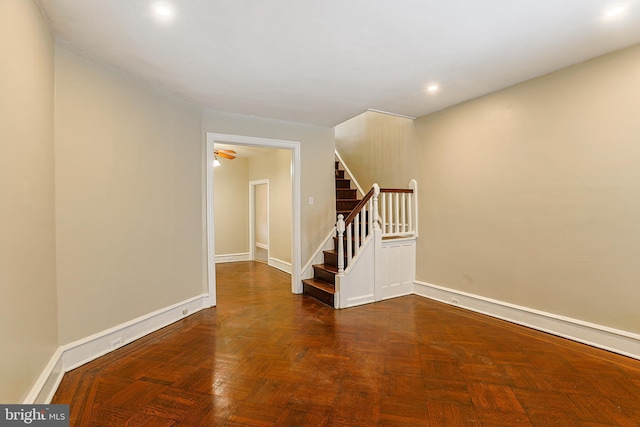 unfurnished room with dark parquet flooring