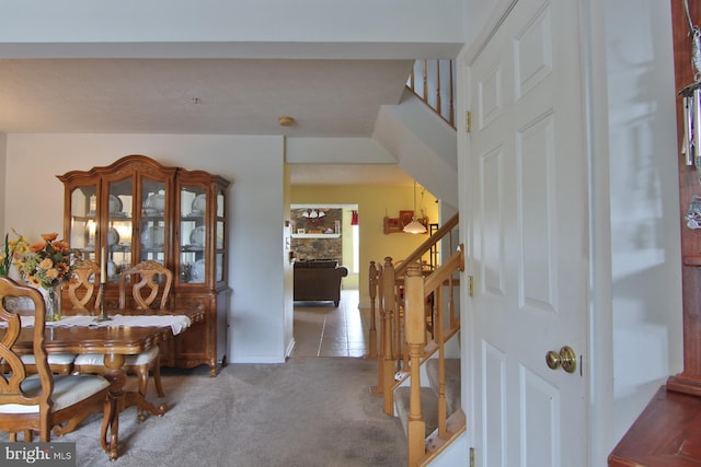 foyer entrance with carpet floors