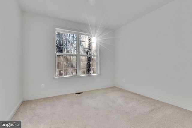 empty room featuring carpet floors