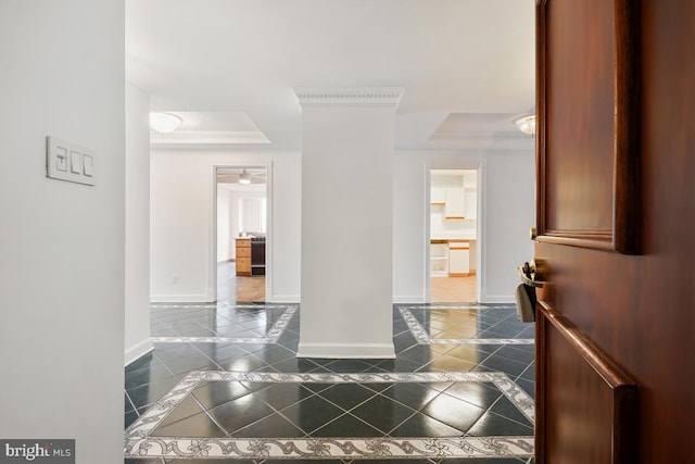 tiled foyer entrance featuring a raised ceiling