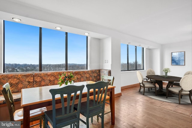 dining area featuring a wealth of natural light and light wood-type flooring