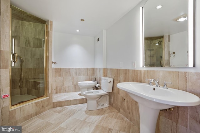 bathroom with a bidet, a shower with shower door, tile walls, and toilet