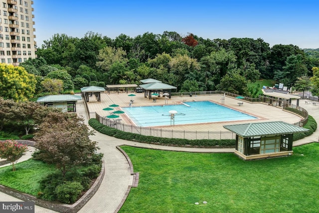 view of swimming pool with a gazebo, a patio, and a lawn