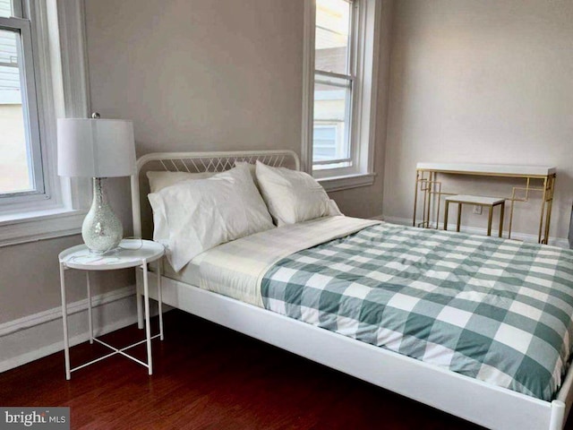 bedroom featuring dark hardwood / wood-style flooring