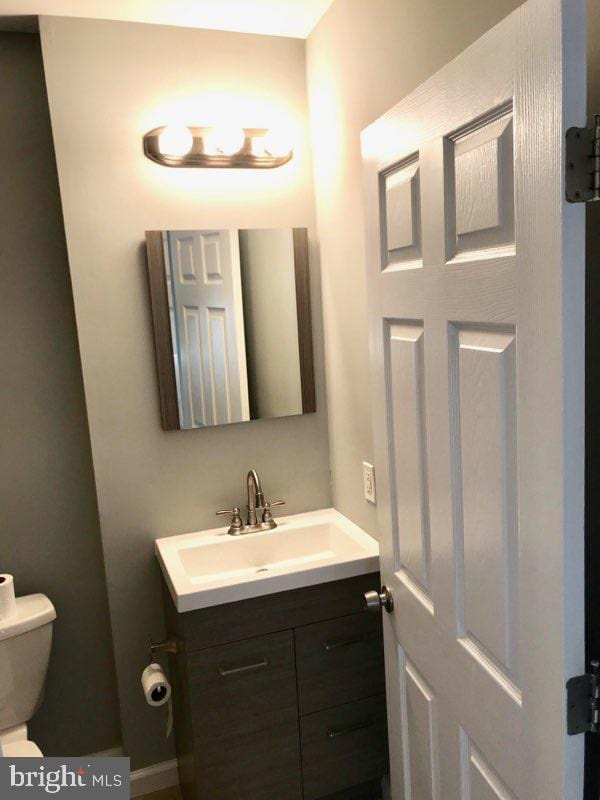 bathroom with vanity and toilet