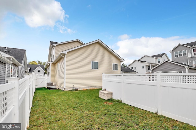 rear view of house with a lawn