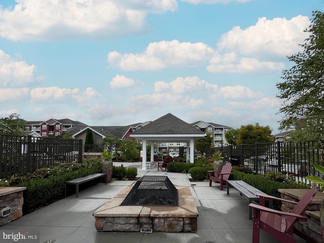 view of patio featuring a gazebo and a fire pit