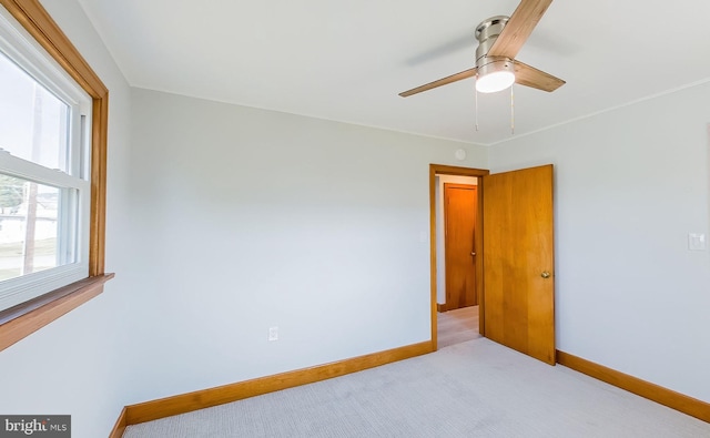 interior space featuring multiple windows and ceiling fan