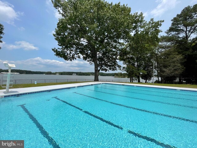 view of home's community featuring a yard and a water view