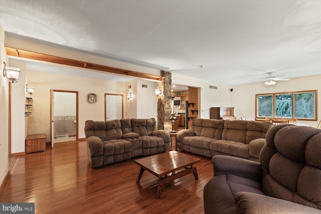 living room with dark wood-type flooring and ceiling fan