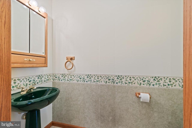 bathroom with tile walls