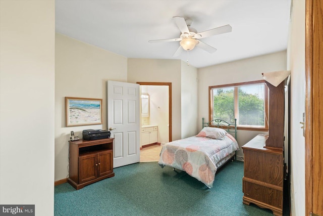 carpeted bedroom with ceiling fan and ensuite bathroom