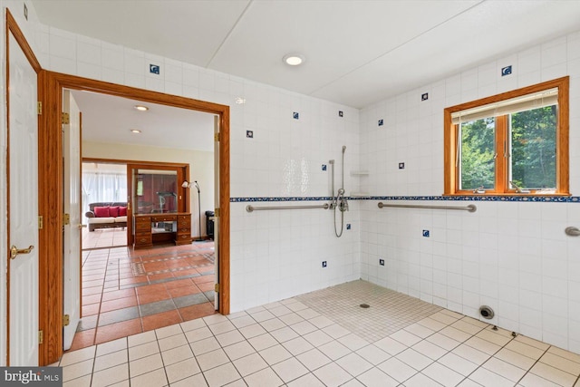 tiled empty room featuring tile walls