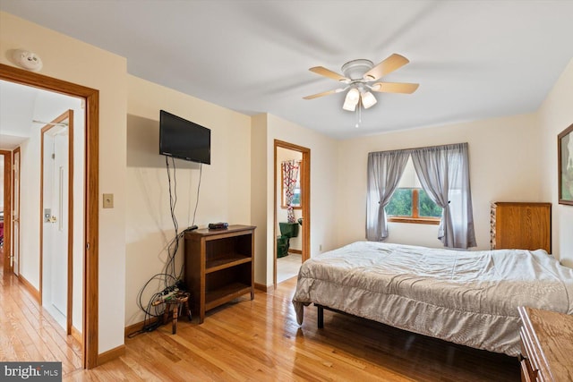 bedroom with light wood-type flooring and ceiling fan