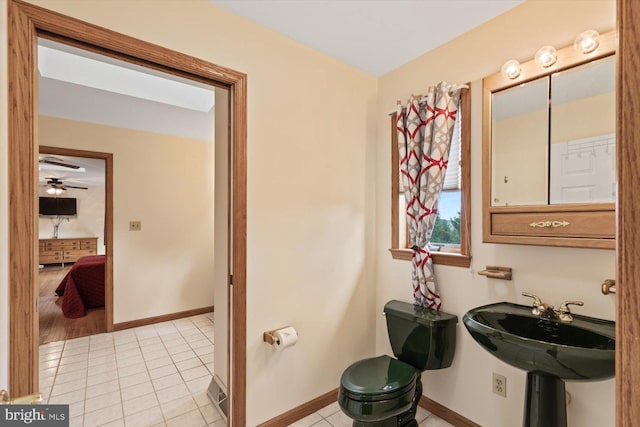 bathroom with tile patterned flooring and ceiling fan