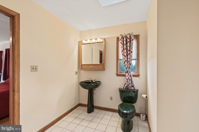 hallway with light tile patterned floors