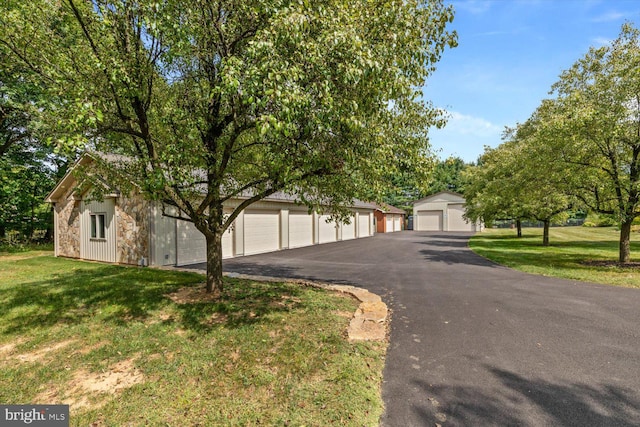 view of front of home with a garage and a front yard