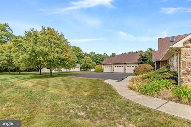 view of yard featuring a garage