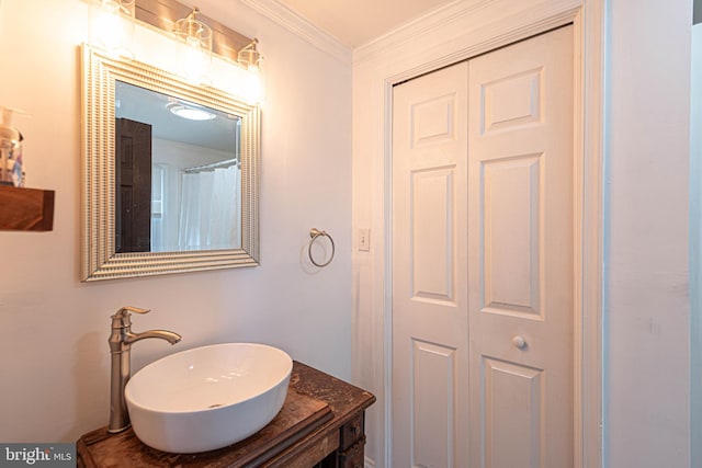 bathroom featuring vanity and crown molding