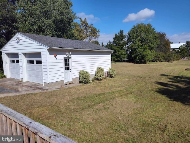 garage featuring a yard