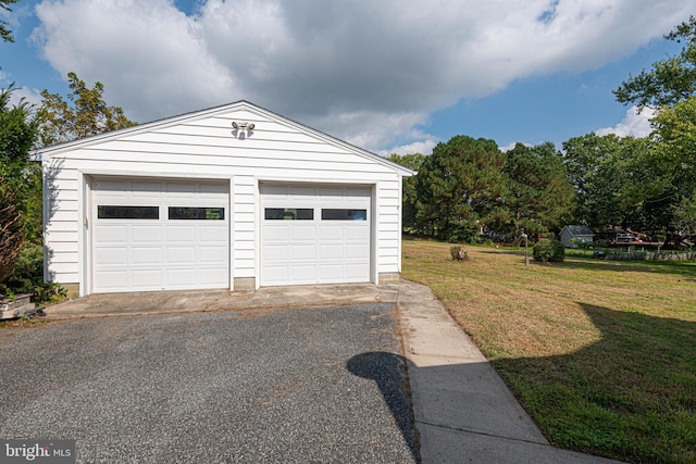 garage with a yard